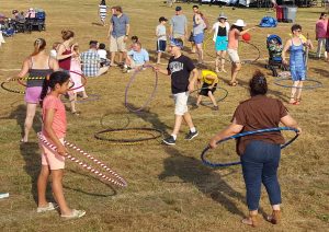 Image of a bunch of people playing with hoops